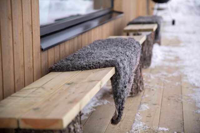 Tegsnäshus bench with sheepskin